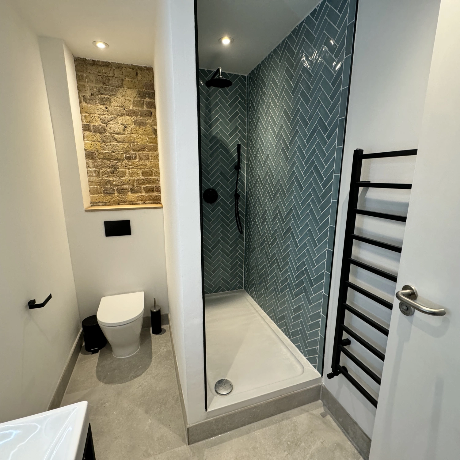 Fitted towel rail and radiator installation image