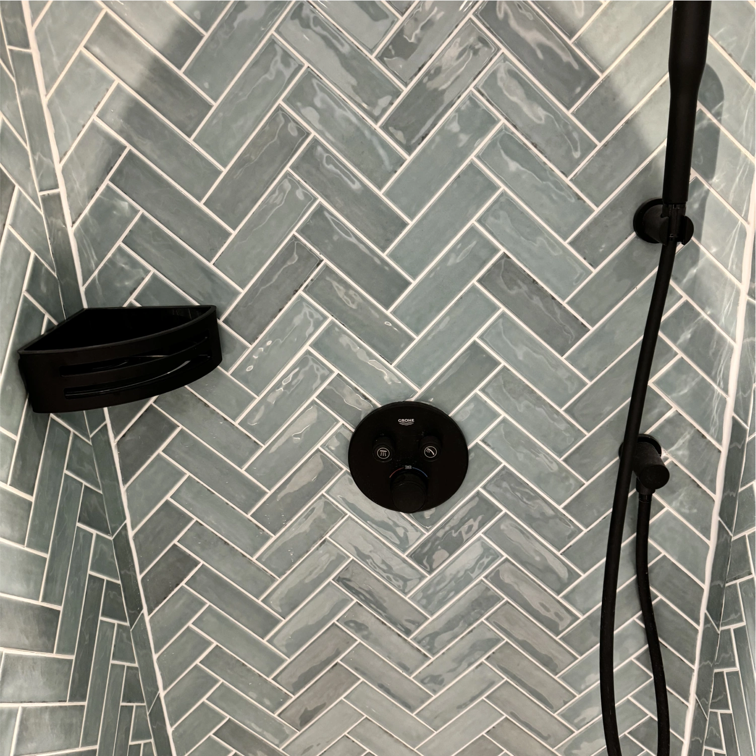 Bath and wall tile close-up with chrome finishes