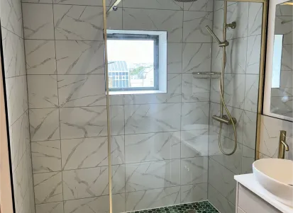 Project image showing new tiled wall and fittings