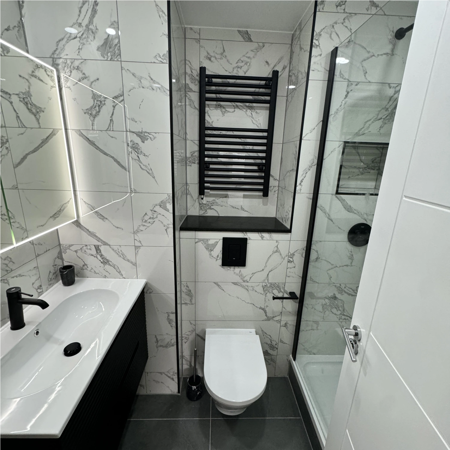 Finished bathroom showing tile patterns and shower